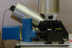 Solid metal cylindrical components arranged on a workbench. 
